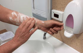 Rub soap into access arm in circular motion for one minute